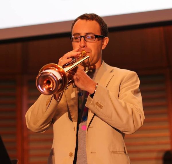 Portrait of Jimi Michel, trumpet player and leader of OompahME